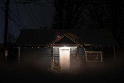 snowy house at night